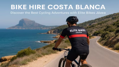 Mountain biker wearing Elite Bikes Jávea gear riding along the Costa Blanca coast with sea and mountains in the background